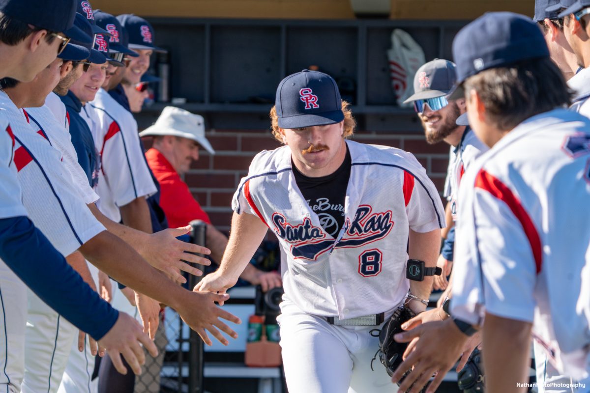 Bear Cubs infielder Joe Brown enters the diamond as his name's called out before their game against West Valley on Jan. 28, 2025. 