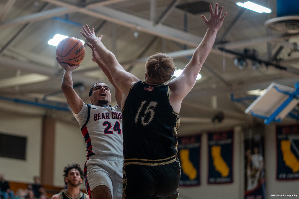 SRJC forward Vincent Jackson leaps over the Miner's Greg Piotrowski as he unleashes a shot against Yuba on Saturday, Mar. 1, 2025 at Haehl Pavilion.  