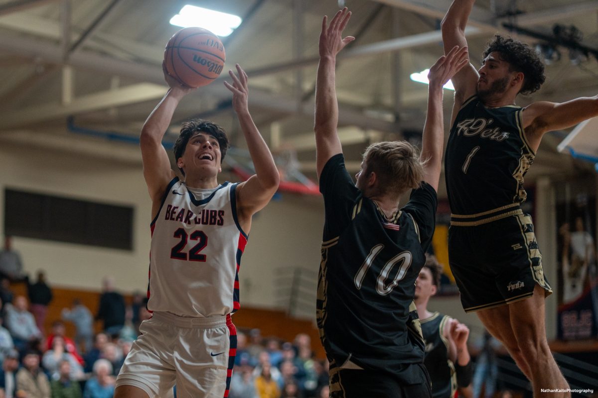 Bear Cubs' guard Andrew Pengel is heavily guarded as he launches the ball up for a lay-up against Yuba on Saturday, Mar. 1, 2025 at Haehl Pavilion.  