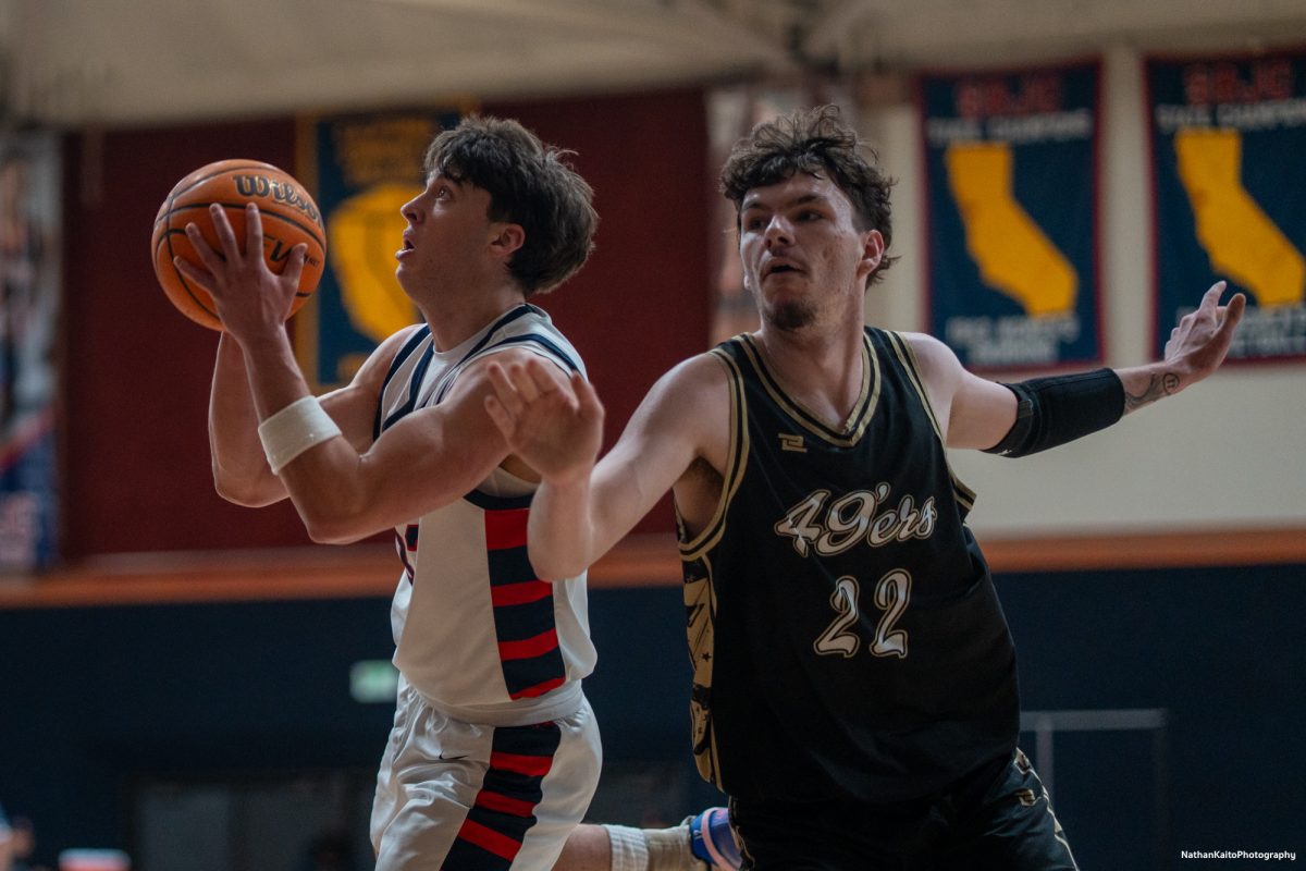 SRJC forward Audon Forgus breezes past the Miner's Dylan Harms as he goes for a lay-up against Yuba on Saturday, Mar. 1, 2025 at Haehl Pavilion.  