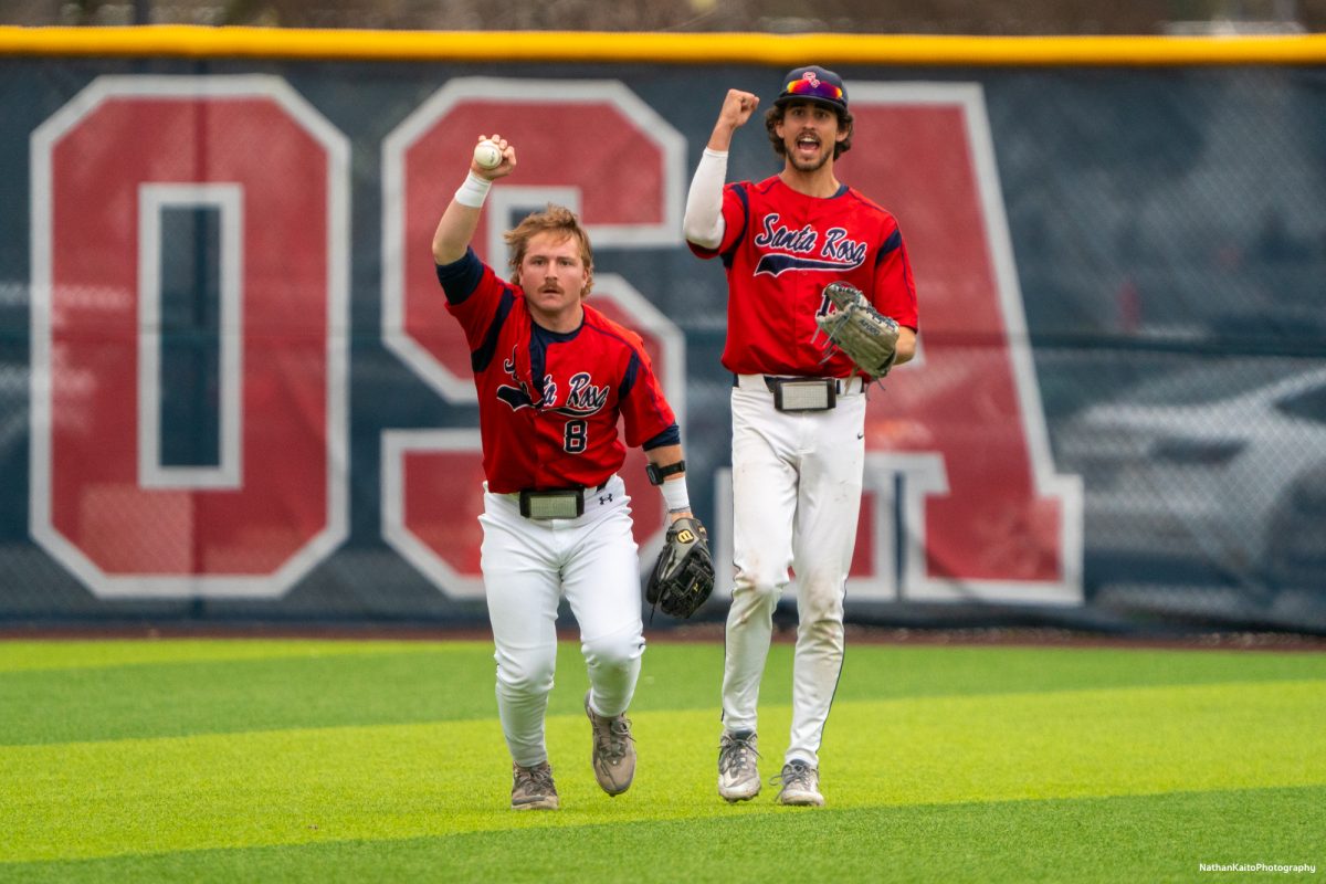 Santa Rosa Junior College infielder Joe Brown shows off the ball after making an out, as teammate Cooper Wood celebrates behind him during the game against San Joaquin Delta on Saturday, March 15, 2025, in Santa Rosa.