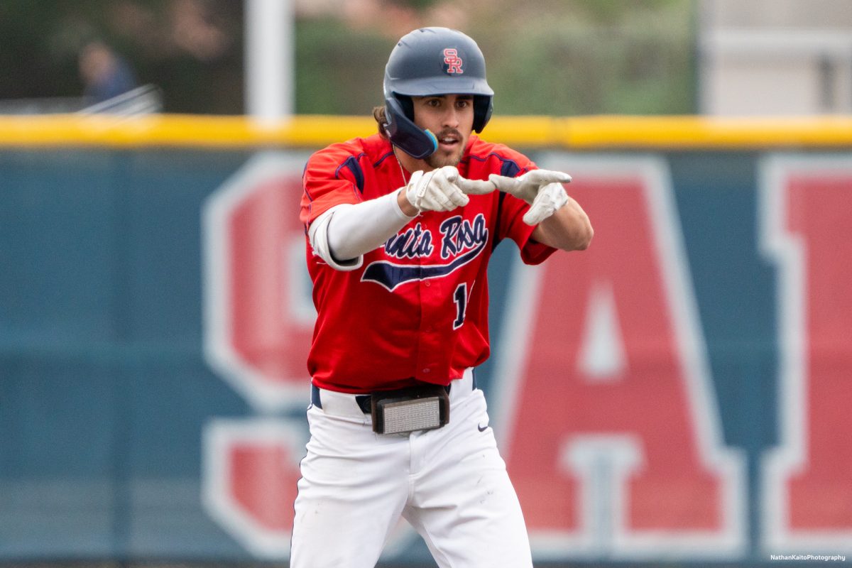 Bear Cubs' freshman center fielder Cooper Wood points to the dugout in celebration after hitting a double against San Joaquin Delta on Saturday, March 15, 2025 in Santa Rosa.