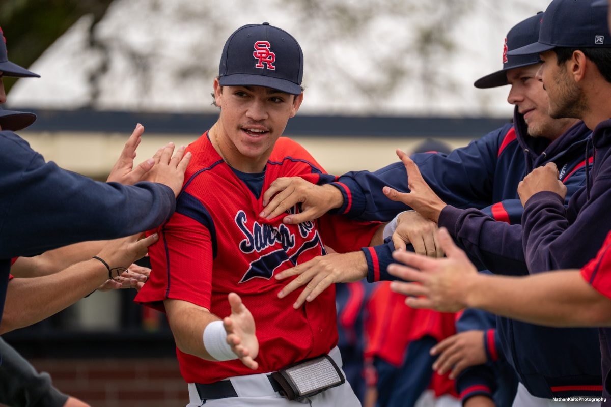 Santa Rosa Junior College's designated hitter J.T. Summers enters the field from the dugout as his teammates shove him around before their game against San Joaquin Delta on Saturday, March 15, 2025 in Santa Rosa.