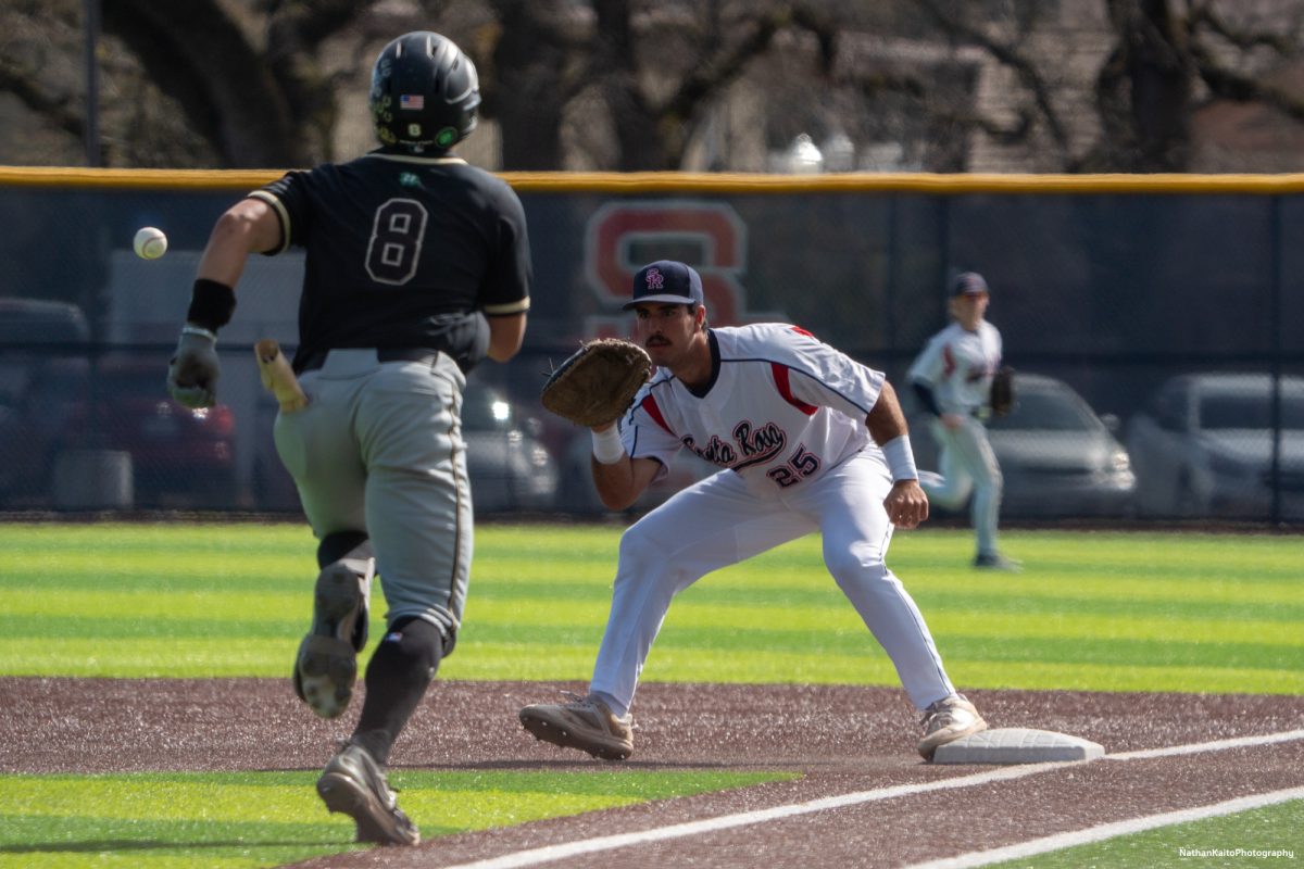 Santa Rosa Junior College's first baseman Josh Martin prepares to the catch the ball as the Mustang's middle infielder Guanzon Ian runs to first base on Tuesday, March 11, 2025 in Santa Rosa. 