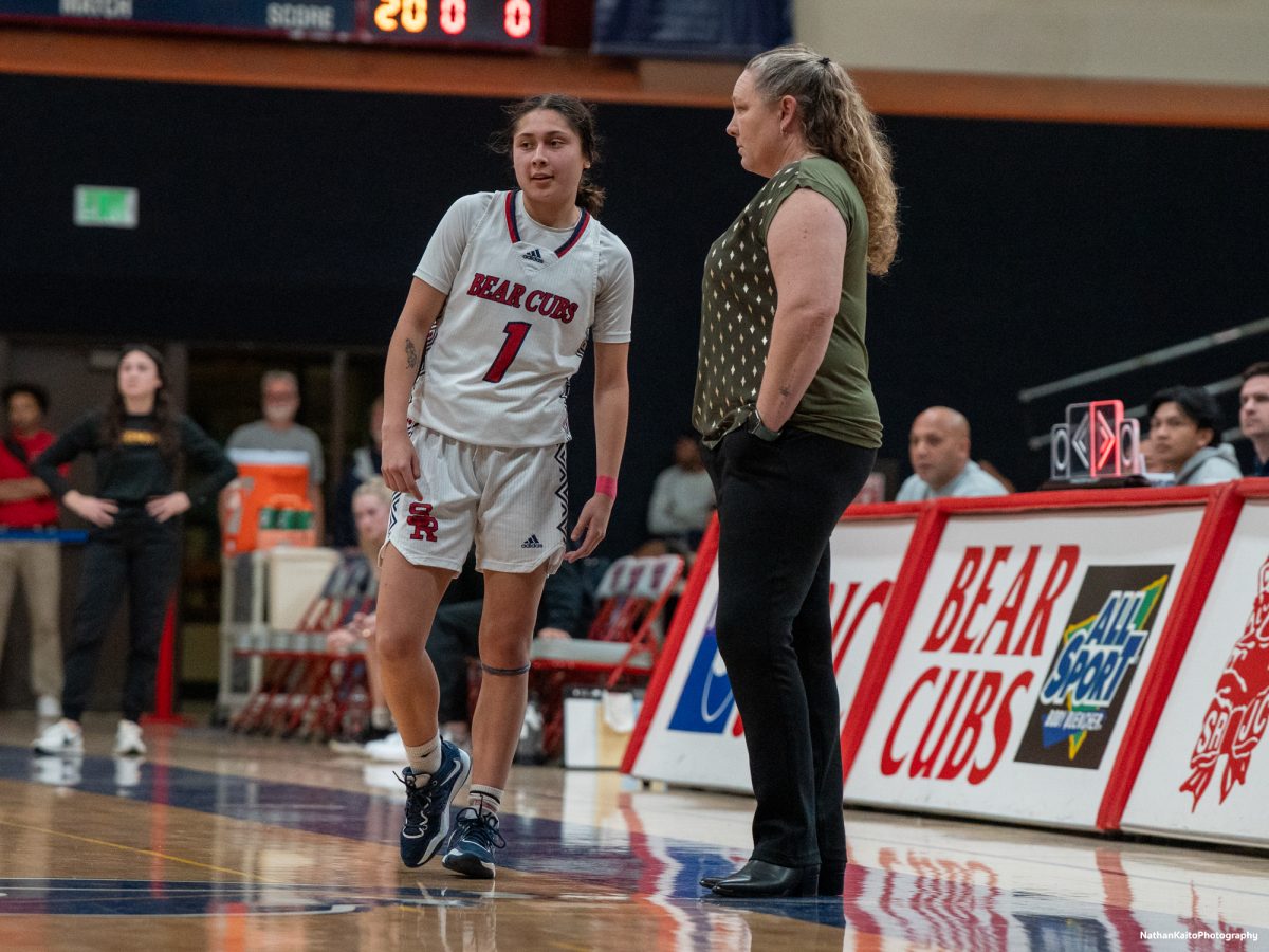 Bear Cubs' guard Lindsey Arellano recieves instructions from headcoach Lacey Campbell, as teammate Ivy Gonzalez prepares to take free-throws against the College of the Redwoods on Wednesday, Feb. 26, 2025 at Haehl Pavilion.