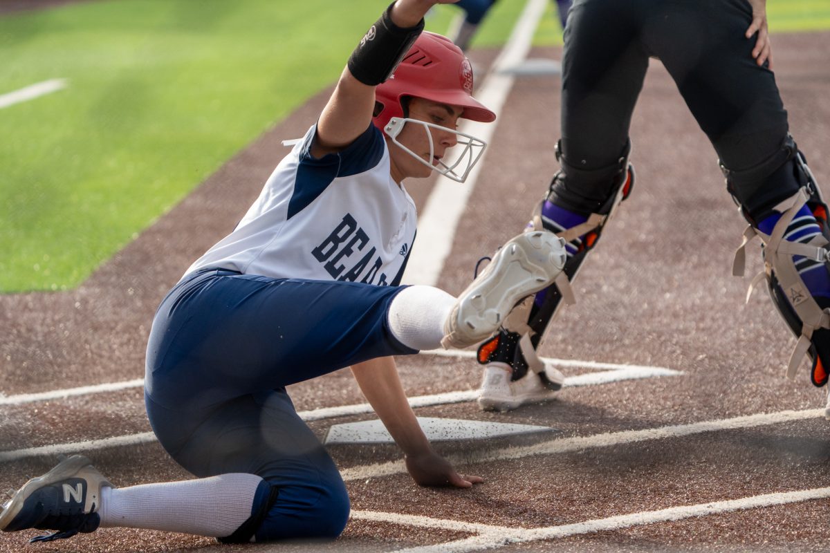 Bear Cubs' utility Kali Garcia powerfully slides to home base during an inspired comeback against Folsom Lake at Marv Mayes Softball Field on Tuesday, Mar. 4, 2025. 