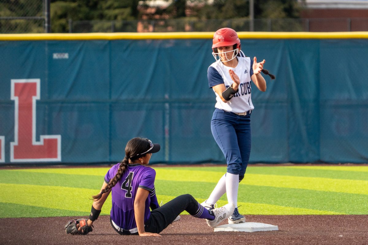 Bear Cubs' utility Kali Garcia claps and stares down the Falcon's Aniya Cruz after taking second base against Folsom Lake at Marv Mayes Softball Field on Tuesday, Mar. 4, 2025. 