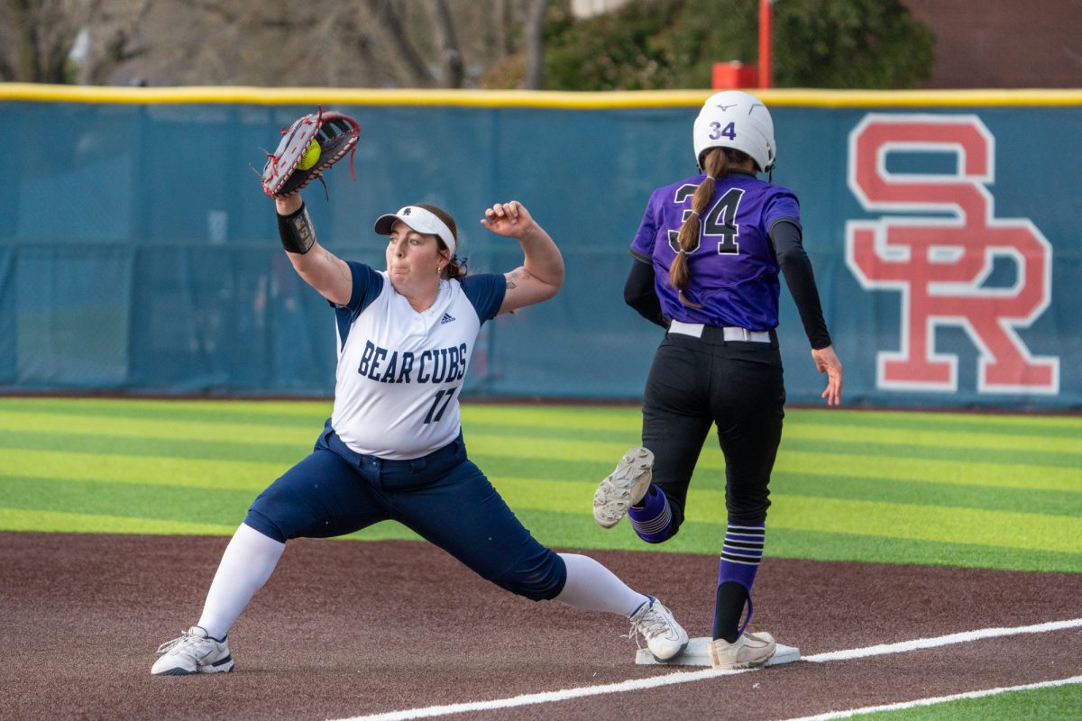 SRJC infielde Sofia Uricoechea catches the ball at first place and gets the Falcon's batter, Sophia Nielsen at Marv Mayes Softball Field on Tuesday, Mar. 4, 2025. 