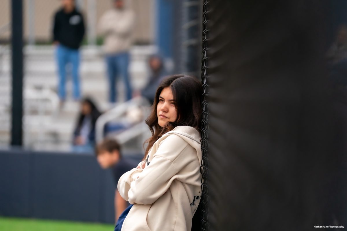 Alum Nataya Brown watches from the front of the dugout during the alumni Home Run Derby on Saturday, March 15, 2025 in Santa Rosa.